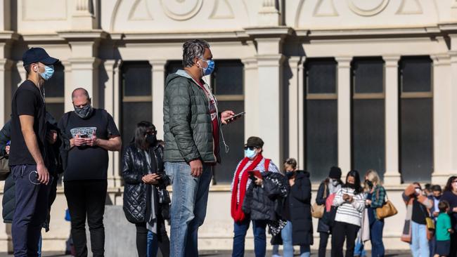 People line up at Melbourne’s Royal Exhibition Building to get the Covid-19 vaccine. Picture: NCA NewsWire / Ian Currie