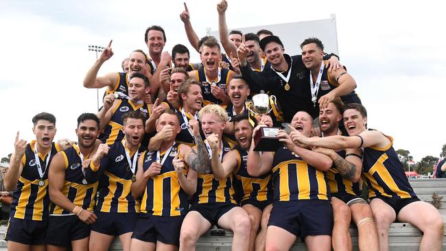 Rupertswood players celebrate their RDFL premiership.