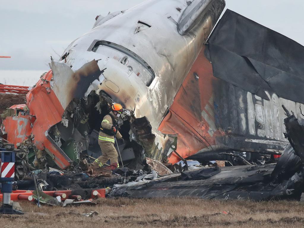 The catastrophic destruction of the plane was caused by it hitting a barrier with experts questioning why it was on the runway. Picture: Chung Sung-Jun/Getty Images