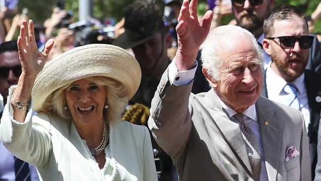 SYDNEY, AUSTRALIA - OCTOBER 20: King Charles III and Queen Camilla wave as they walk during a visit to St. Thomas's Anglican Church, on October 20, 2024 in Sydney, Australia. The King's visit to Australia will be his first as Monarch, and CHOGM in Samoa will be his first as Head of the Commonwealth. (Photo by Toby Melville-Pool/Getty Images)