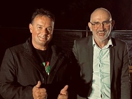 Tamborine Mountain State School principal Jason Smith with Paul Kelly.