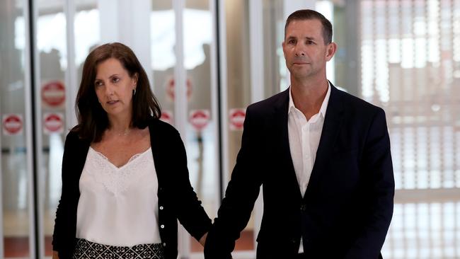 Mark Coyne arrives in Sydney with wife Annie by his side. Picture: Toby Zerna