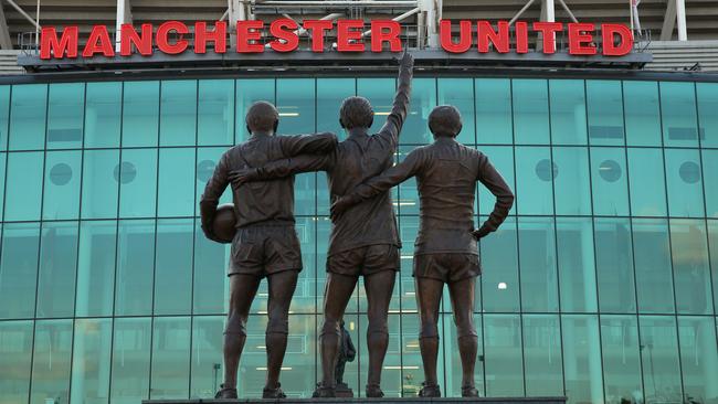 Statue of George Best, Bobby Charlton and Denis Law outside Old Trafford.