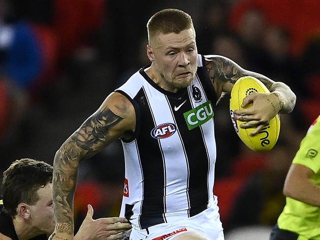 MELBOURNE, AUSTRALIA - MARCH 05: Jordan De Goey of the Magpies is tackled by Riley Collier-Dawkins of the Tigers during the AFL Community Series match between the Collingwood Magpies and the Richmond Tigers at Marvel Stadium on March 05, 2021 in Melbourne, Australia. (Photo by Quinn Rooney/Getty Images)