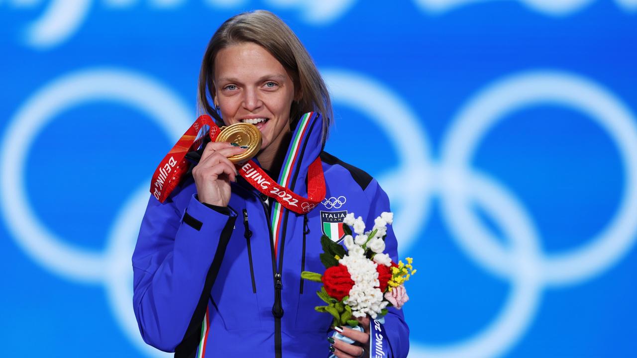 Arianna Fontana shows off her gold. Photo by Richard Heathcote/Getty Images.