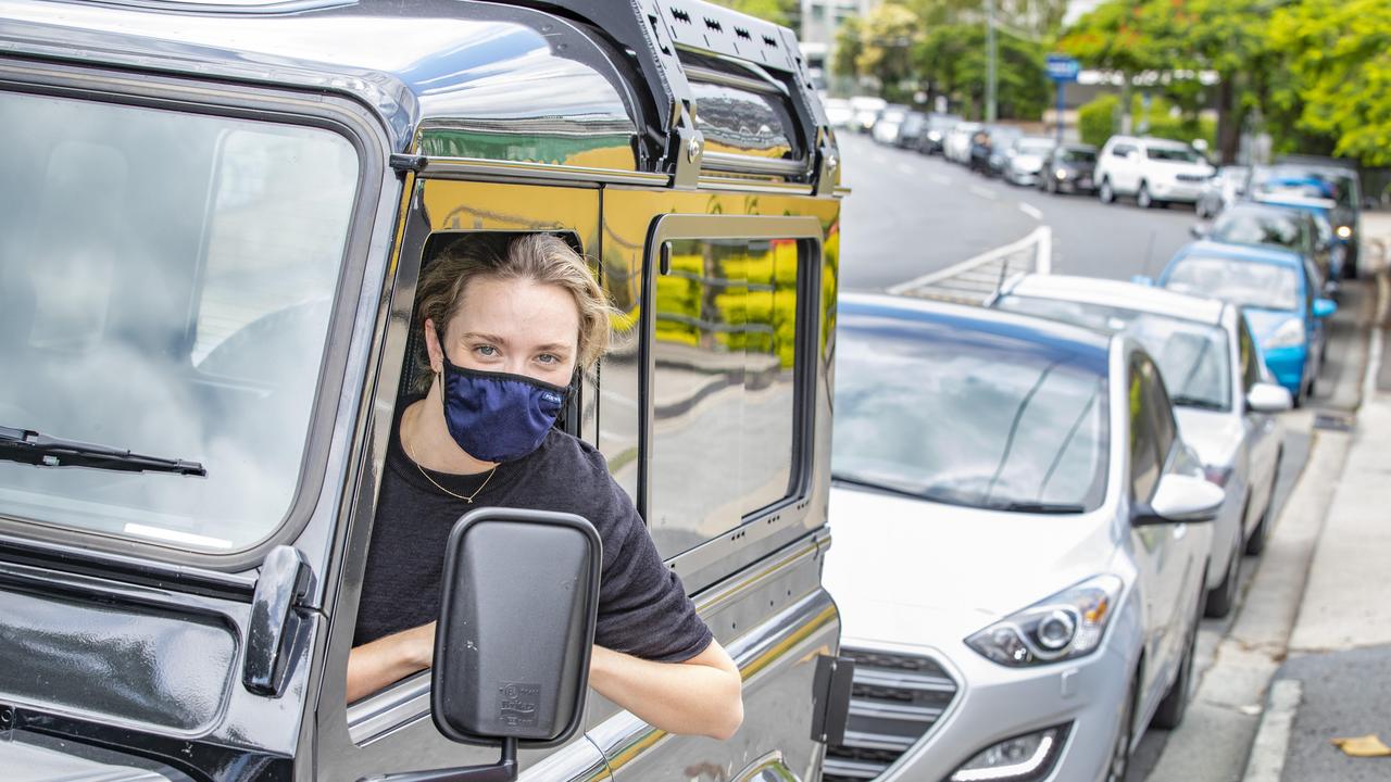 Anna Walch, of Teneriffe, queued on Montpelier Road to get to the COVID-19 drive through testing site at Sullivan Nicolaides Pathology, Hurworth Street, Bowen Hills, on Sunday. Picture: Richard Walker