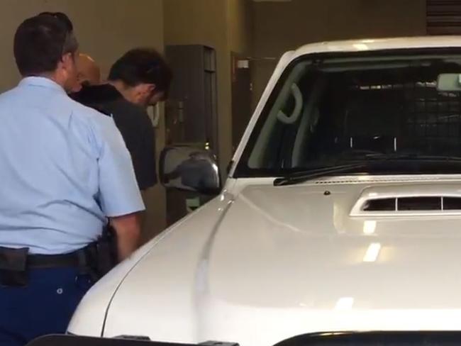 Mark Stocco being led to a police car / Picture: Channel 10/Twitter