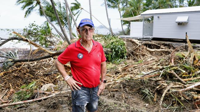 Tom Hedley stands in the Ellis Beach holiday park amid significant damage. Picture: Brendan Radke