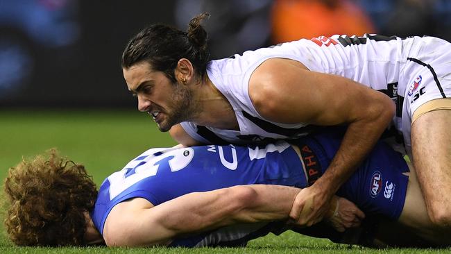 Brodie Grundy has been suspended for two weeks for this tackle on Ben Brown. Picture: AAP