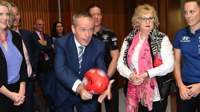 Bill Shorten show his handball skills at a Parliamentary Friends of Women’s AFL inaugural event at Parliament House in Canberra. Picture Kym Smith