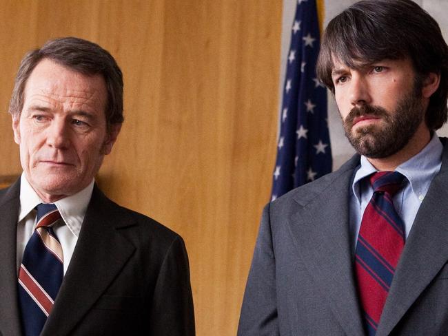 FILE - This undated publicity film image released by Warner Bros. Pictures shows Bryan Cranston, left, as Jack O'Donnell and Ben Affleck as Tony Mendez in 'Argo,' a rescue thriller about the 1979 Iranian hostage crisis. 'Argo' earned a adapted screenplay nomination from the Writers Guild on Friday, Jan. 4, 2013, for outstanding screen writing. (AP Photo/Warner Bros., Claire Folger, File)