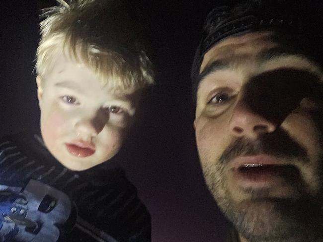 "Letâs take a photo for mum and dad because they are looking for you and we can just show them youâre okay and weâre coming home": Rescuer Adam Goncalves, 34, took this photo of he and three-year-old Xavier Death, who had been missing for nearly four hours. Picture: supplied