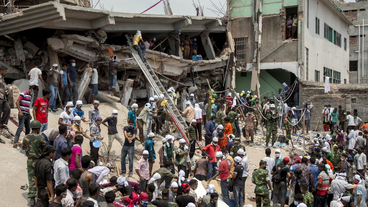 Rescue workers and volunteers search by hand for victims in the debris of the collapsed Rana Plaza building the day after the building collapsed. Picture: Jeff Holt / Bloomberg via Getty Images