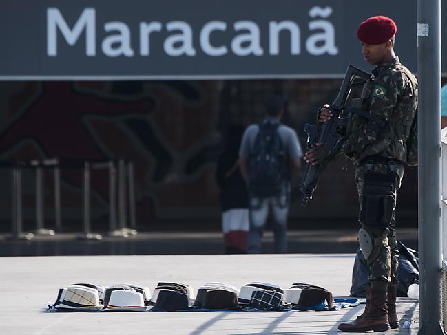 Brazilian paratroops stand guard outside the Maracana stadium in Rio de Janeiro, Brazil on July 9, 2016, ahead of the Rio Olympic Games. / AFP PHOTO / CHRISTOPHE SIMON