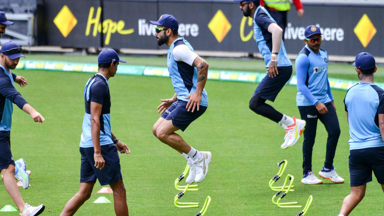 Ready for action: Kohli (centre) attends a training session with teammates.