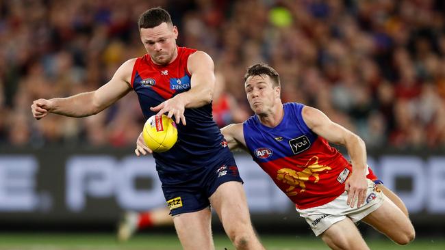 MELBOURNE, AUSTRALIA – SEPTEMBER 09: Steven May of the Demons evades Lincoln McCarthy of the Lions during the 2022 AFL Second Semi Final match between the Melbourne Demons and the Brisbane Lions at the Melbourne Cricket Ground on September 9, 2022 in Melbourne, Australia. (Photo by Dylan Burns/AFL Photos via Getty Images)