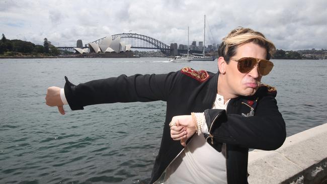 Take that, sheep: Milo Yiannopoulos offers up some of his trademark incisive social commentary, striking at the very heart of Australian society with an eviscerating thumbs down to the Sydney Opera House. (Pic: Nathan Richter)