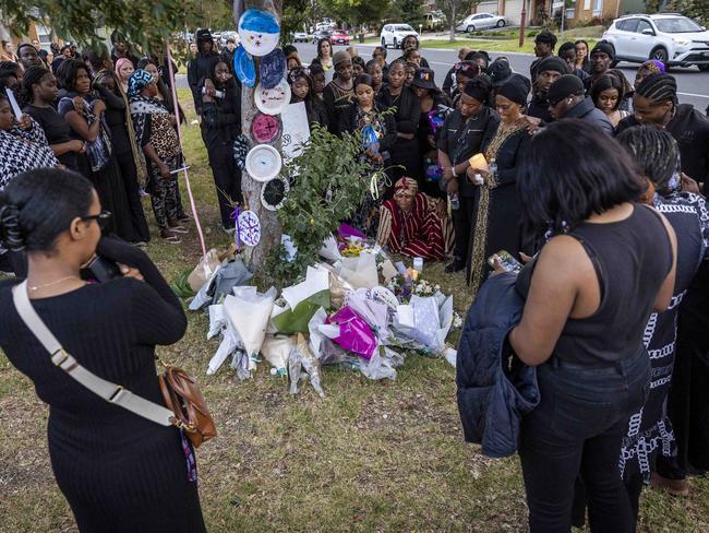 The nature strip where Nathan was found dead is flooded with tributes. Picture: Jake Nowakowski