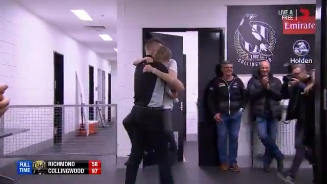 Collingwood coach Nathan Buckley with son Jett after the Pies' win over Richmond.