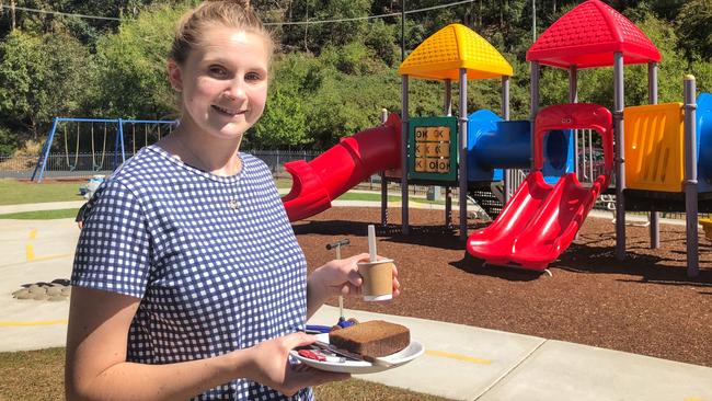 Rivulet Cafe barista and cafe manager Charlotte Smith serves a babycino and banana bread in the outdoor play area. Picture: PATRICK GEE