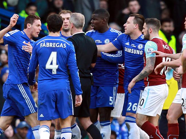 Chelsea's Serbian midfielder Nemanja Matic (L) reacts after receiving a red card during the English Premier League football match between Chelsea and Burnley at Stamford Bridge in London on February 21, 2015. AFP PHOTO / SEAN DEMPSEY RESTRICTED TO EDITORIAL USE. NO USE WITH UNAUTHORIZED AUDIO, VIDEO, DATA, FIXTURE LISTS, CLUB/LEAGUE LOGOS OR "LIVE" SERVICES. ONLINE IN-MATCH USE LIMITED TO 45 IMAGES, NO VIDEO EMULATION. NO USE IN BETTING, GAMES OR SINGLE CLUB/LEAGUE/PLAYER PUBLICATIONS.