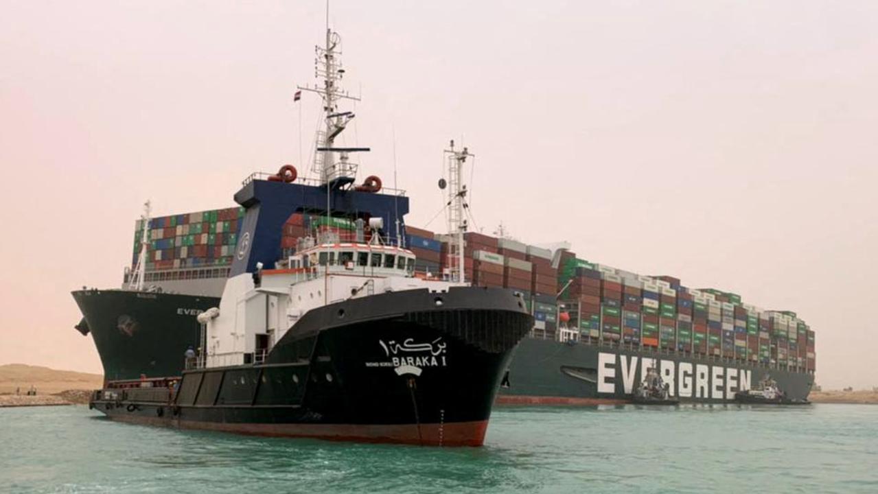 Tugboats have been used to try and move the vessel. Picture: Marina Passos/Suez Canal Authority/AFP