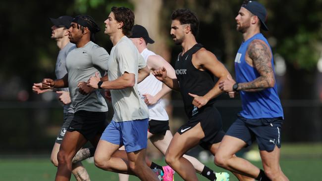 The Pies get to work. Picture: Michael Klein