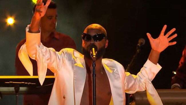 Donning a white suit and bug-like sunglasses, Genesis Owusu performed at the ABC’s broadcast. Picture: supplied.