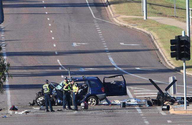 Police at the aftermath of a fatal collision at the intersection of Tiger Brennan Dr and Berrimah Rd. Picture: Katrina Bridgeford