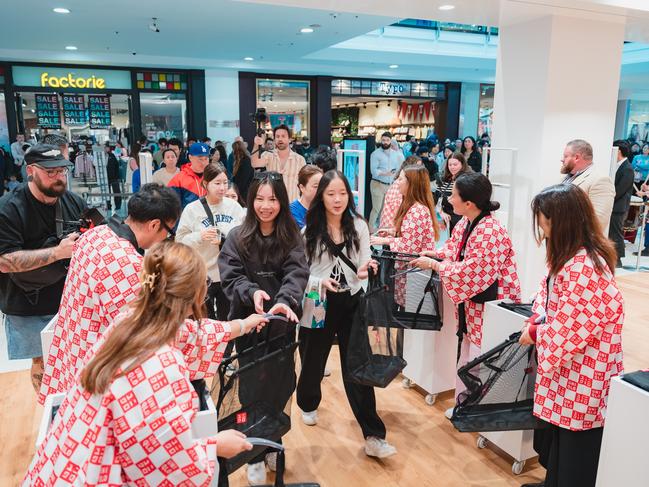 The first customers to Uniqlo at Westfield Mt Gravatt were greeted by the stores new staff. Picture: Supplied.