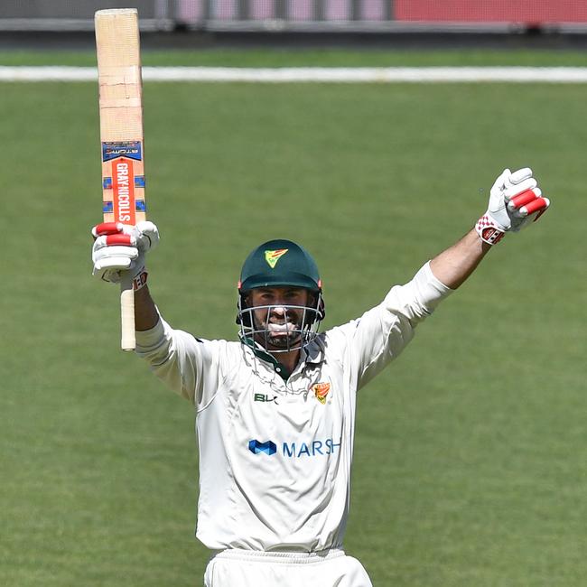 Alex Doolan celebrates one of his 11 centuries for Tasmania (AAP Image/David Mariuz)