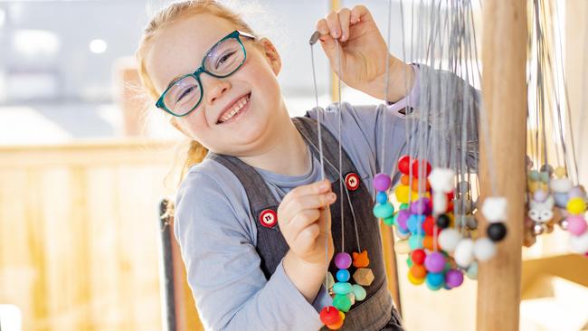 Scarlett Fox, 6, has been making bead necklaces to raise funds for Cystic Fibrosis Tasmania. Picture: RICHARD JUPE