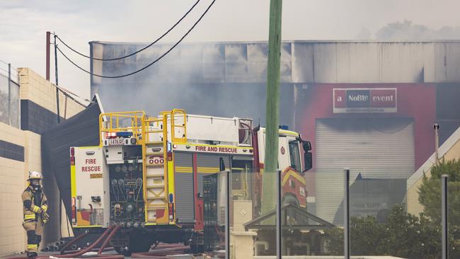 The building was left smouldering on Tuesday morning. Picture: Matthew Poon