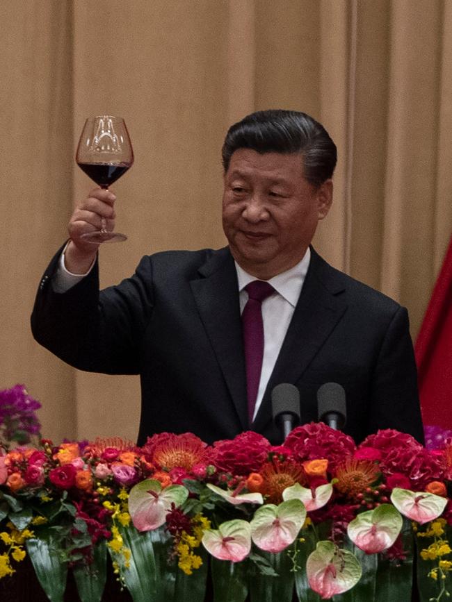 China's President Xi Jinping raises a toast at a reception to celebrate the 70th anniversary of the founding of the People's Republic of China at the Great Hall of the People in Beijing on September 30, 2019.