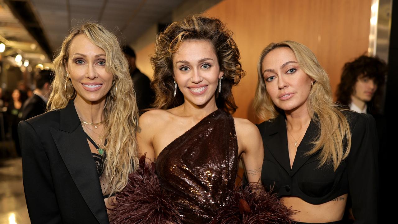 L-R: Tish, Miley and Brandi Cyrus at the Grammys this week. Picture: Neilson Barnard/Getty