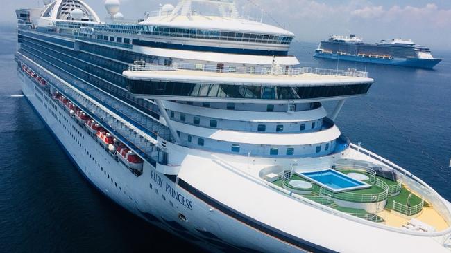 The Ruby Princess cruise ship lies at anchor in Manila Bay in The Philippines, where quarantine officials will swab 214 Filipino crew before ­allowing them to disembark.