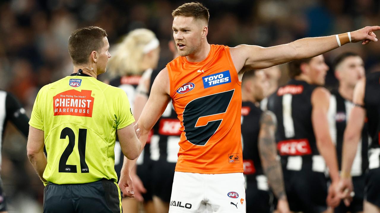 MELBOURNE, AUSTRALIA - SEPTEMBER 22: Harry Himmelberg of the Giants speaks with AFL Field Umpire, Simon Meredith during the 2023 AFL First Preliminary Final match between the Collingwood Magpies and the GWS GIANTS at Melbourne Cricket Ground on September 22, 2023 in Melbourne, Australia. (Photo by Michael Willson/AFL Photos via Getty Images)