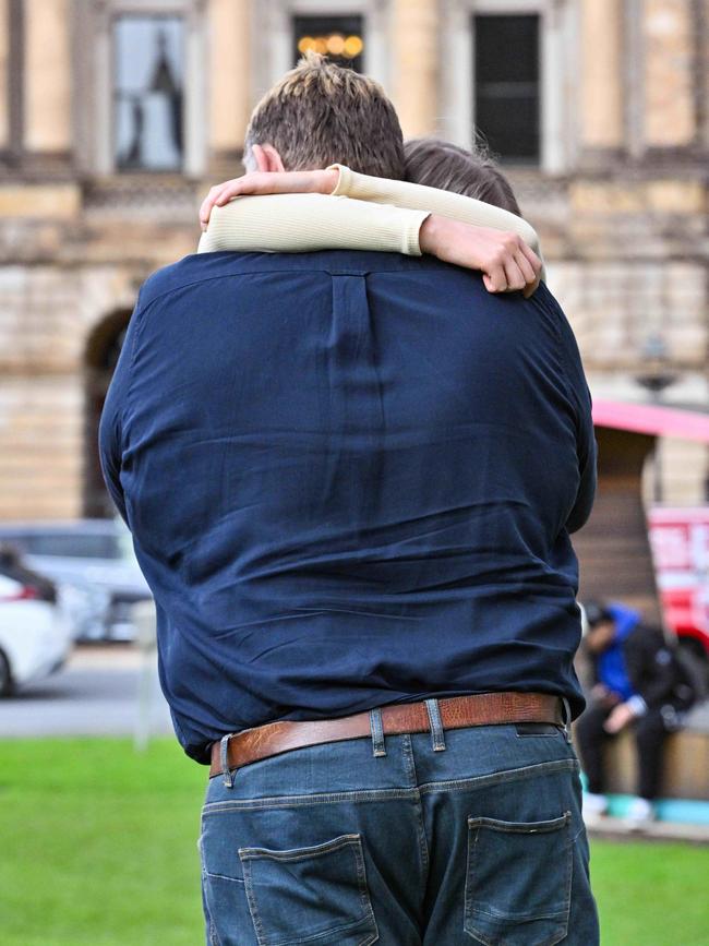 “Cristina” and her father embrace outside the District Court after SA Police officer Jordan Lloyd Koch was jailed for sexually assaulting her. That conviction has now been overturned. Picture: NCA NewsWire / Brenton