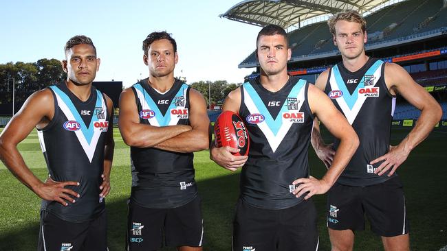 Dom Barry, Steven Motlop, Tom Rockliff and Jack Watts at Adelaide Oval ahead of Round 1 this year. Picture Sarah Reed