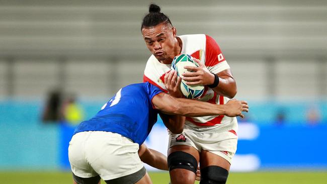 Hendrik Tui of Japan is tackled by Ed Fidow of Samoa. Picture: Getty Images