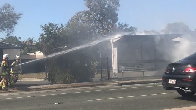 A bus stop goes up in flames at Broadbeach Waters, Gold Coast. Picture: Scarlett Madden