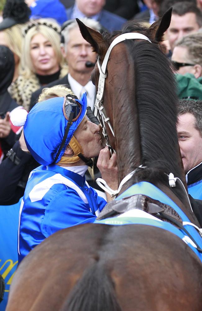 Hugh Bowman gives his girl at kiss. Picture: David Crosling