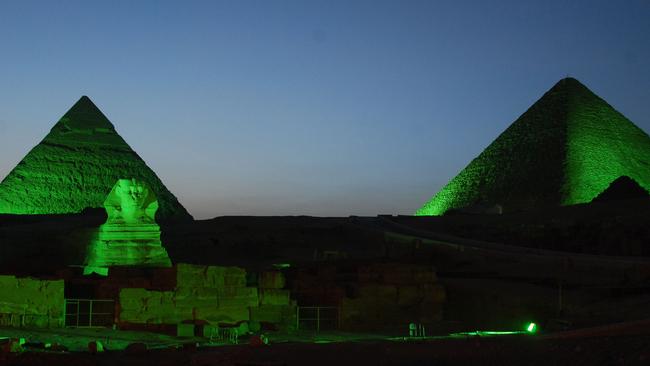 Two of the three Giza Pyramids and the Sphinx lit up in green in 2013. Picture: AFP