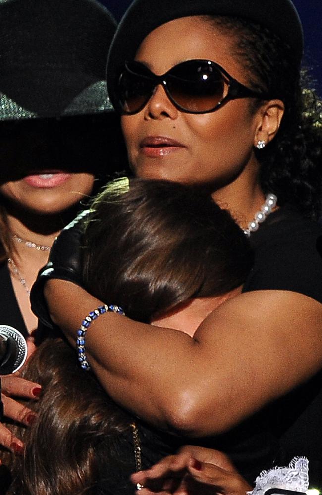 Janet comforts niece Paris Jackson during Michael’s memorial service in 2009. Picture: AFP/Pool/Gabriel Bouys