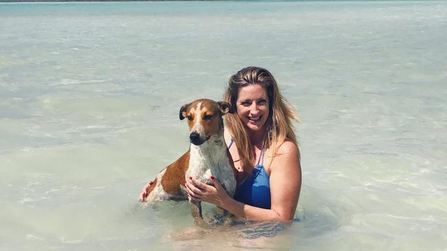 Taxi the dog with his soon to be owner Liza-Jane Sowden in Santo, Vanuatu