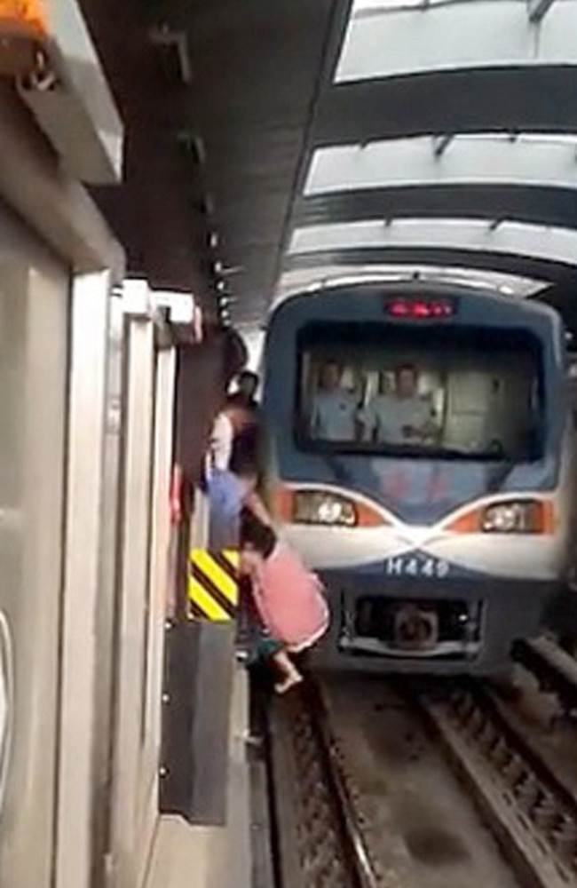 So lucky: Yue Yan Mai survives being run over by a train.