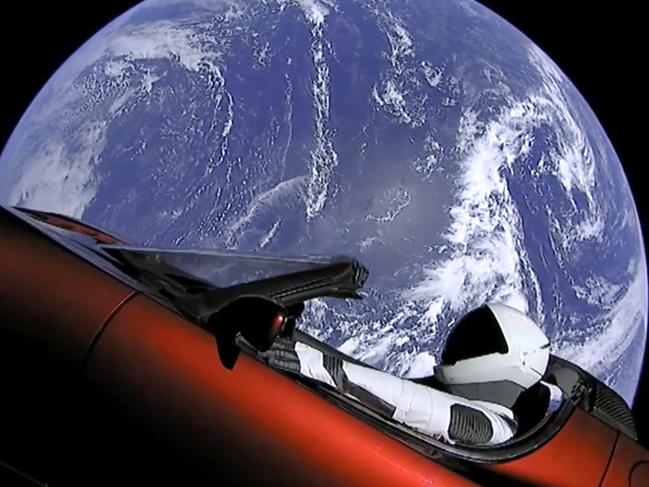 This image from video provided by SpaceX shows the company's spacesuit in Elon Musk's red Tesla sports car which was launched into space during the first test flight of the Falcon Heavy rocket on Tuesday, Feb. 6, 2018. (SpaceX via AP)