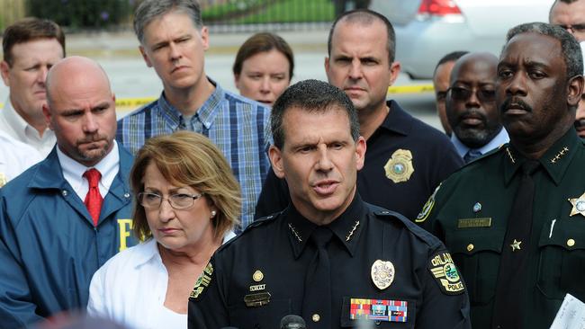 Orlando Police Chief John Mina, law enforcement and local community leaders speak during a press conference June 12, 2016 in Orlando, Florida.