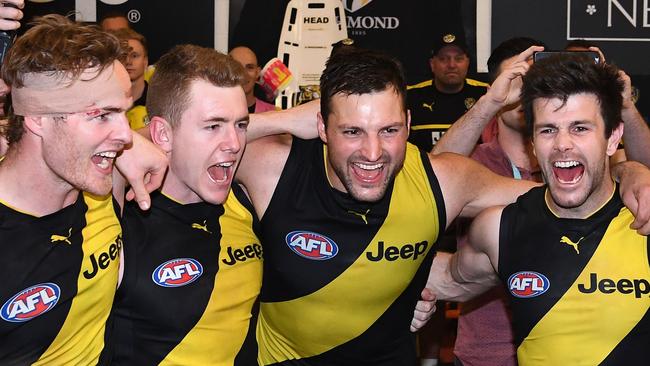 David Astbury, Jacob Townsend, Nankervis and Trent Cotchin sing the song after winning the preliminary final. Picture: Getty Images