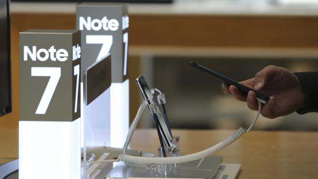 A shopper tries out a Samsung Electronics Galaxy Note 7 smartphone, now removed from sale. Picture: Lee Jin-man.